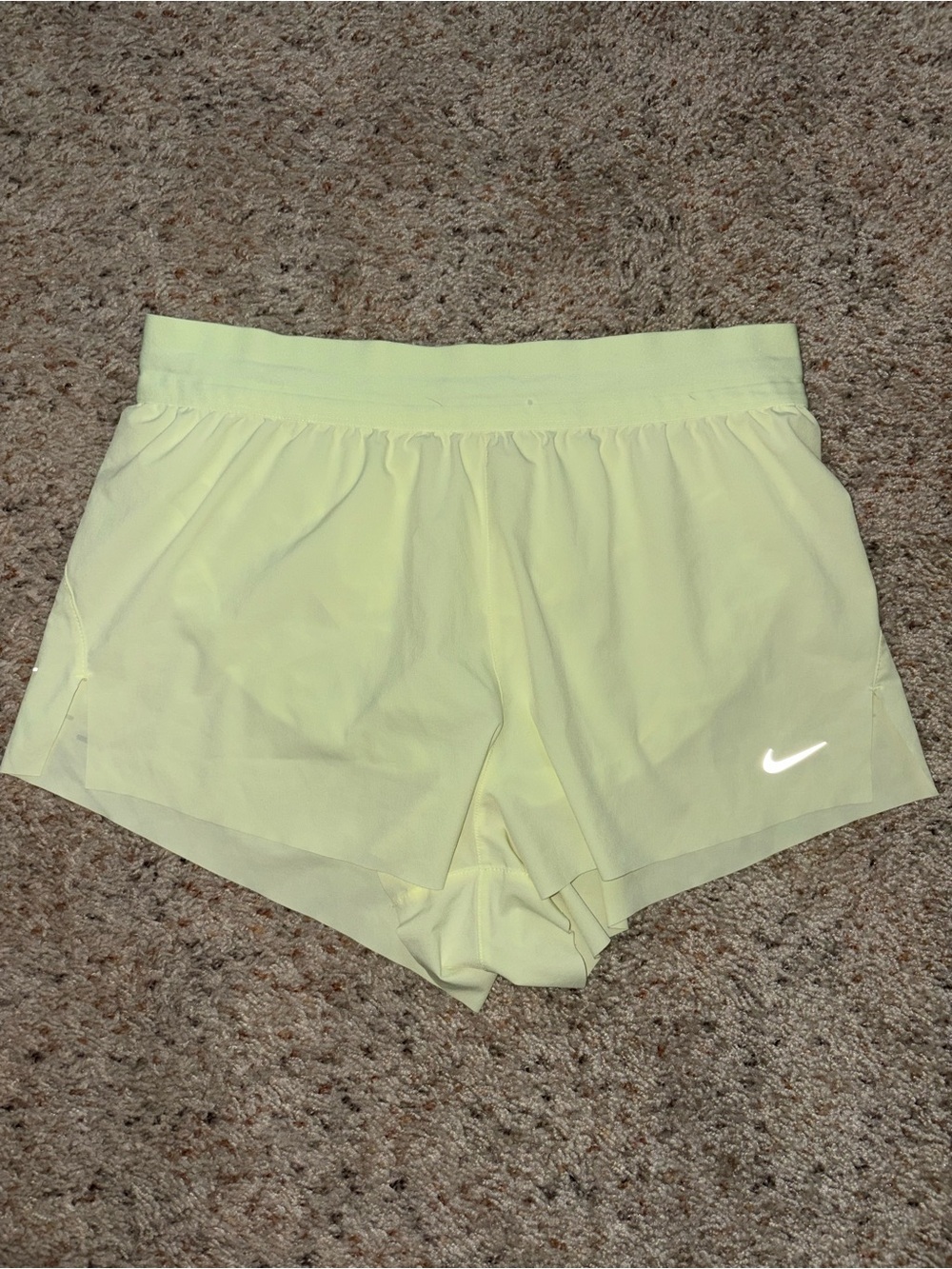 Nike Women's Pale Yellow Athletic Shorts with Reflective Swoosh